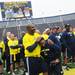 DiAllo Johnson jokes around with Alijah Bradley after the Victors Classic alumni football game at Michigan Stadium on Saturday. Melanie Maxwell I AnnArbor.com